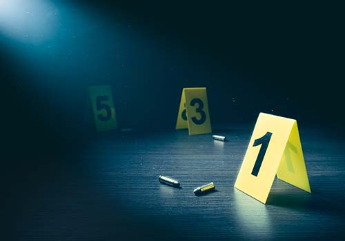 High contrast image of a crime scene with evidence markers.