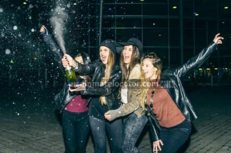 Disorderly conduct: A group of girls opening a champagne bottle in public spraying it everywhere.