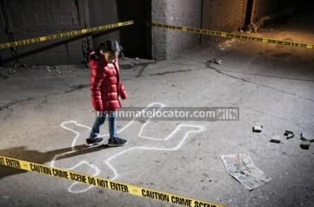 A child walking over a chalk outline of a body at a murder scene.
