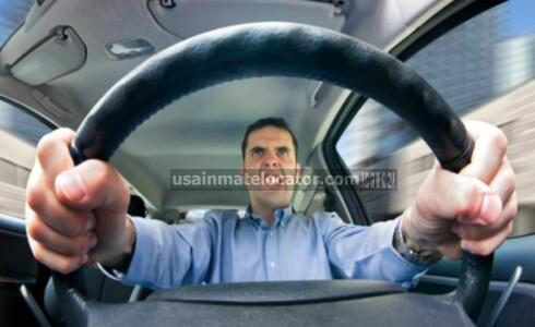 Reckless Driving: An angry man behind the wheel of his car driving recklessly.