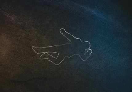 An overhead image of a chalk body outline on the pavement symbolizing a crime scene.