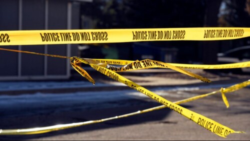Police tape at a capital murder crime scene.