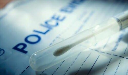 DNA swab on top of police evidence folder.
