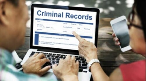 A couple searching criminal records online.
