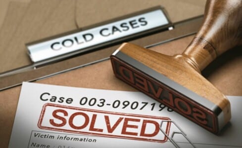 A cold case folder with a "SOLVED" stamp on it.