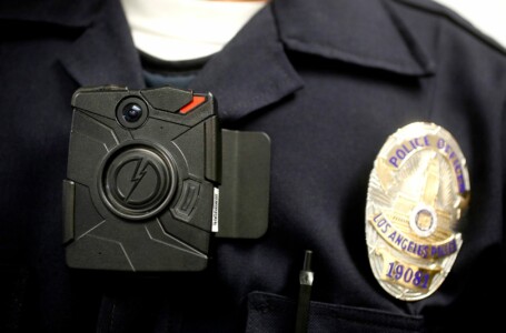 A police officer wearing a body camera.