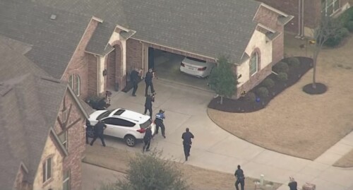 Cops on a residential property after a chase.